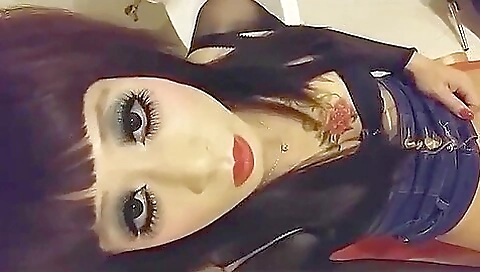 A brunette ladyboy is dressed as a slut and she gets fucked