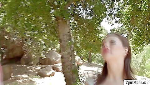 Brunette enjoys a deepthroating with her man in the backyard